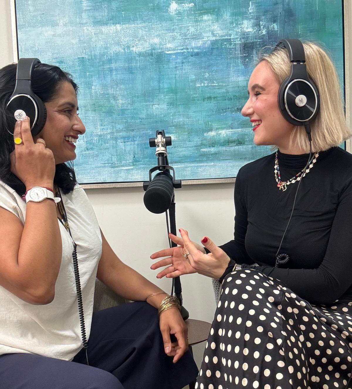 A photo of Anji Gopal and Annie Lewis recording their podcast